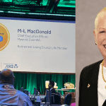 Marie-Louise MacDonald speaking on-stage